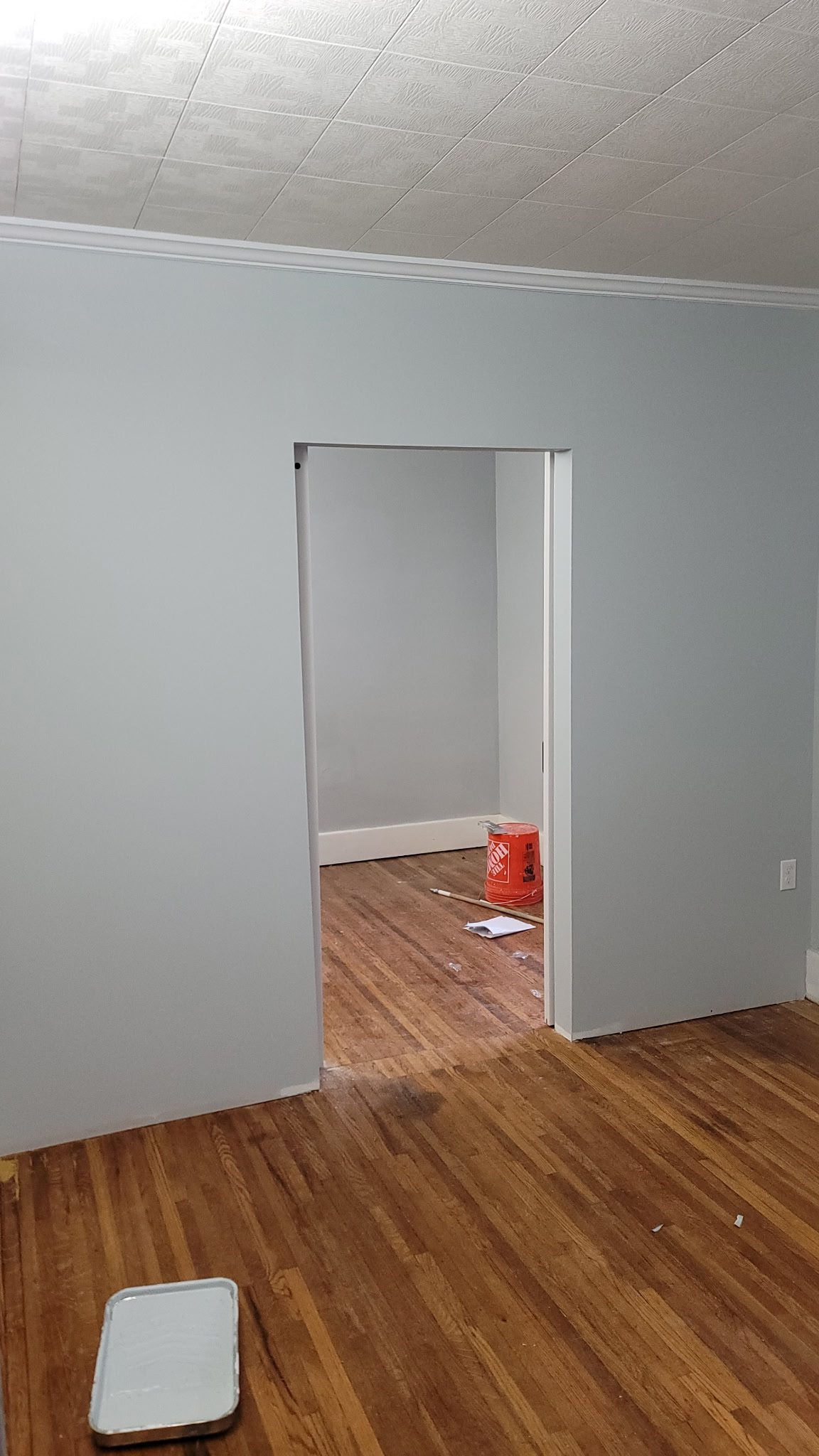 Freshly painted room with wooden floor.